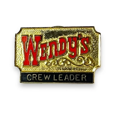 Prendedor de solapa vintage Wendy’s esmaltado corbata líder de equipo tono dorado coleccionable Foto 1 de 3