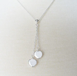 LIQUIDACIÓN - Colgante con 2 pequeños corazones enchapados en plata de ley con cadena de 18" - Imagen 1 de 3