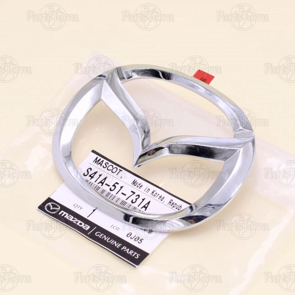 Fabricante de equipos originales Mazda PROTÉGÉ MILLENNIA 2001-03 cromo parrilla delantera logotipo emblema S41A-51-731A Foto 1 de 4