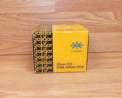 Lente gran angular Soligor 28 mm f2,8 genuina para cámara Conon-FD con filtro y tapa  Foto 1 de 4