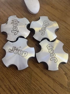 C092. 2001-2004 Jeep Grand Cherokee Center Caps - Picture 1 of 7