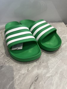 mint green adidas slides