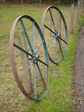 LARGE PAIR OF ANTIQUE IRON WHEELS AND NAME PLATE