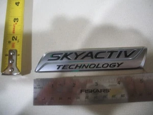 MAZDA SKYACTIV TECHNOLOGY CHROME EMBLEM SYMBOL BADGE OEM ORIGINAL GENUINE - Bild 1 von 1
