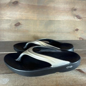 oofos oolala Mujer Talla 6 Zapatos Dorado Negro Chanclas Sandalias Recuperación - Imagen 1 de 9