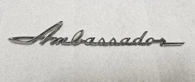 AMC Rambler Ambassador 1962 emblema guardabarros delantero OEM  Foto 1 de 4