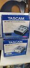 Tascam US-144/US 122 USB 2.0 Audio/MIDI Interface Units  with boxes read notes