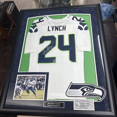 Framed Marshawn Lynch Seattle Seahawks Autographed White Jersey 44x36 Local P Up - Image 1 of 4