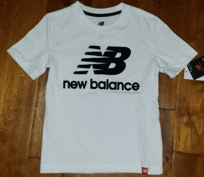 Boy's New Balance Munsell White Short Sleeve T-Shirt Top Sizes 4, 5-6, 7 - Image 1 of 3