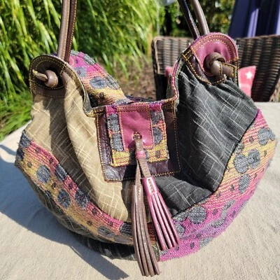 Bolso de mano Cirque Du Soleil con borla geométrica tela y cuero  Foto 1 de 4