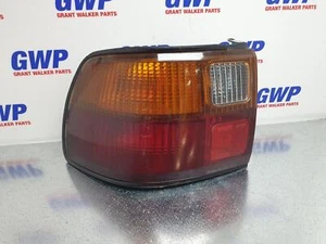 FORD LASER LEFT TAIL LIGHT KF-H SEDAN 04/90-03/94 - Picture 1 of 2