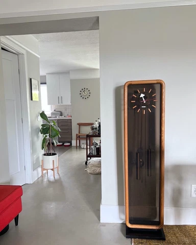 Mid century modern grandfather clock designed by George Nelson for Howard Miller Cover