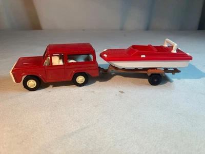 VTG Tootsie Toy 1970 Buckin Ford Bronco SUVw  Boat and Trailer - Image 1 of 4