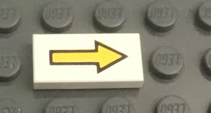LEGO White Tile 1 x 2 with Yellow Arrow Long with Black Outline Pattern - Picture 1 of 1