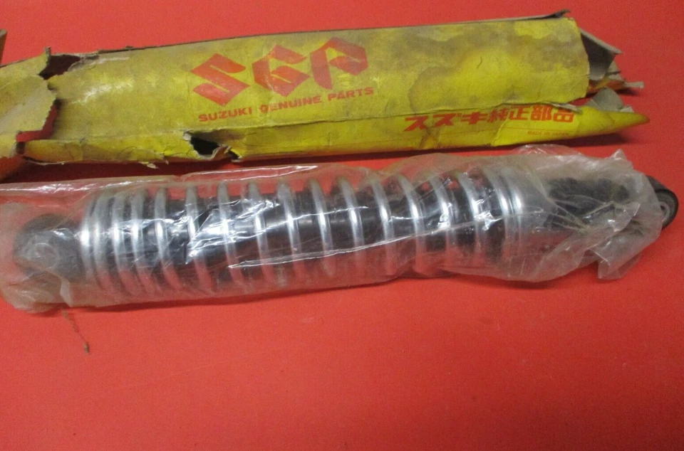 NUEVO DE LOTE AMORTIGUADOR TRASERO ORIGINAL OEM SUZUKI DS100 DS125 TS100 62100-48000 Foto 1 de 1