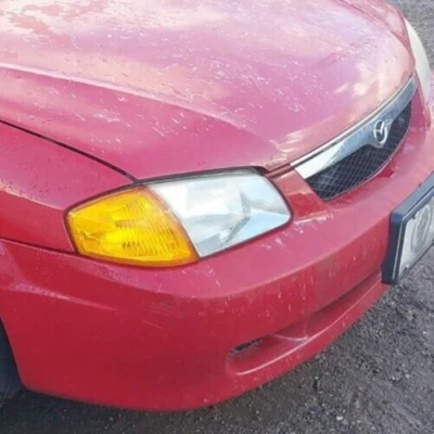 马自达 Protege,1999 年,2000 年,右乘客车头灯带支架 — 第 1/4 张图片