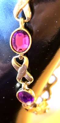 Pulsera AVON Tono Dorado y Amatista Infinito Foto 1 de 4