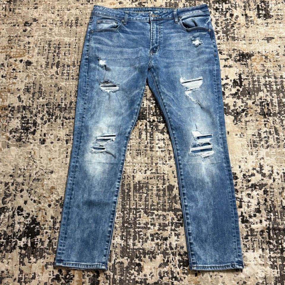 Pantalones de mezclilla para hombre American Eagle 36x30 ajustados flexibles desgastados lavado medio azul Foto 1 de 4