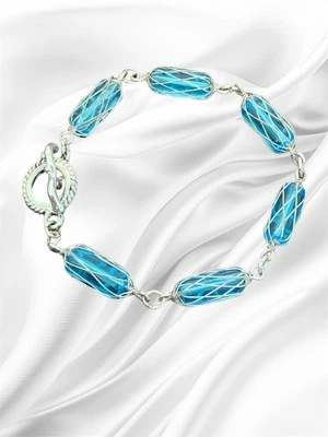 "Brazalete de vidrio azul tono plata envuelto en alambre, cierre de palanca 8"" elegante regalo usado en excelente estado" Foto 1 de 4