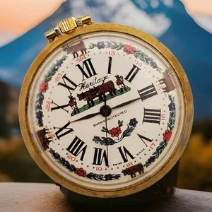 VINTAGE HERITAGE SWISS FARM THEME MECHANICAL HANDWIND POCKET WATCH FOR PARTS - Picture 1 of 9