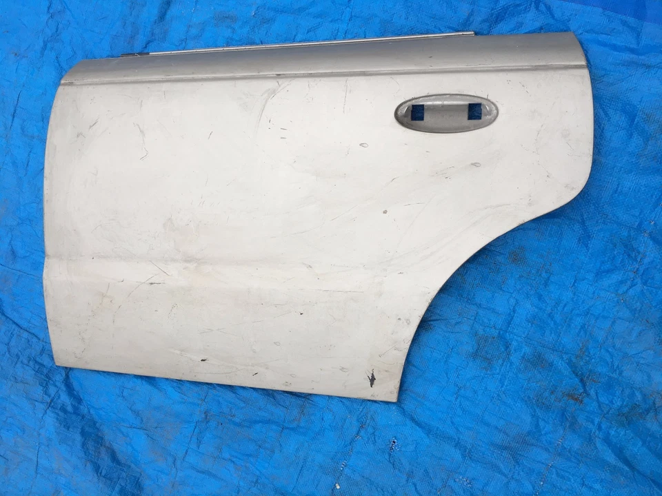 00 - 02 Panel puerta trasera izquierda Saturn serie L LS LS1 LS2 L100 L200 L300 WA548F OE Foto 1 de 4