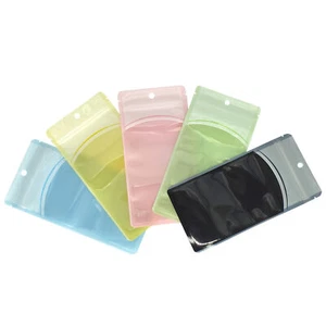 100 bolsas de plástico transparente/color resellables con cierre de cremallera con orificio para colgar para reembalaje - Imagen 1 de 11