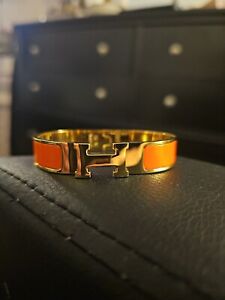 Hermes  H Clic Clac bracelet ORANGE Enamel With  Gold Plated Hardware.