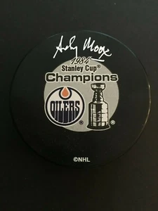 ANDY MOOG AUTOGRAPHED OILERS 1984 STANLEY CUP CHAMPIONS PUCK C.O.A. - Picture 1 of 3