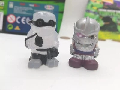 2 TMNT Tortugas Ninja OOSHIES Lápiz Toppers B&W MICHELANGELO Y TRITURADORA DE TITANIO Foto 1 de 4