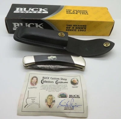 Y36) NEW IN BOX 2003 CUSTOM BUCK SHOP 110 BUFFALO HORN CHIP FLINT FOLDING KNIFE - Image 1 of 4