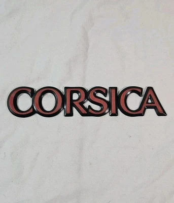 1987-1996 Chevrolet "Corsica" Plastic Door Emblem - RED - As Removed - 20649410 - Image 1 of 4