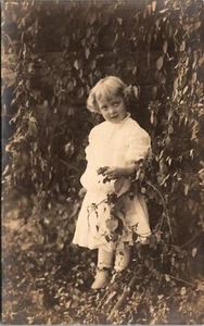Pretty Little Girl Next to Vine Covered Wall RPPC - Picture 1 of 2