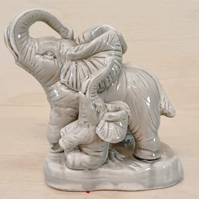 Gray Ceramic Baby with Mother Raised Trunk elephant figurine 4.75” - Image 1 of 4