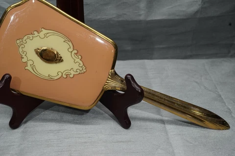 Gold Gilded Handheld Beveled Mirror with Bakelite Cover