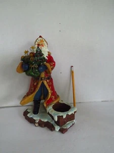 PORTACANDELE DA CAMINO IN RESINA BABBO NATALE CON BORSA GIOCATTOLO, ALBERO E ALTRO - Foto 1 di 7