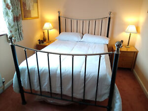 Victorian style metal black and silver finish 4 foot 6 inch wide double bed. 