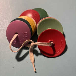 Vintage Plastic/Celluloid Baby Rattle Plakies Colorful Discs On Shoe Lace - Picture 1 of 6