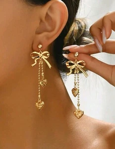 Elegante colgante de corazón de metal hueco y moño de moda - Imagen 1 de 6