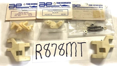 TEAM ASSOCIATED RC10 BUGGY WHITE FRONT SUSPENSION SETUP A-ARM, BLOCK, CARRIER - Image 1 of 4