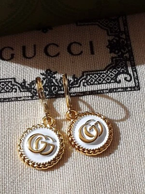Pendientes Gucci Dijes Metal Logo GG Foto 1 de 4
