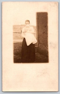 RPPC Young woman with a baby - Picture 1 of 2