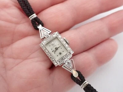 Reloj suizo antiguo decorativo Girard Perregaux para dama 24 diamantes oro blanco 14K 1952 Foto 1 de 4