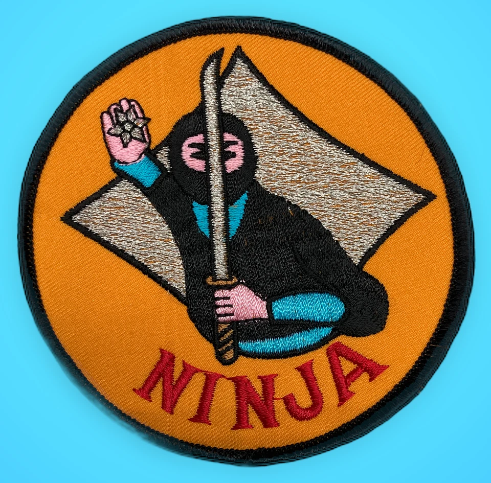 Ninja with Orange Background Patch - Diameter: 4" (Sew On) - Image 1 of 1
