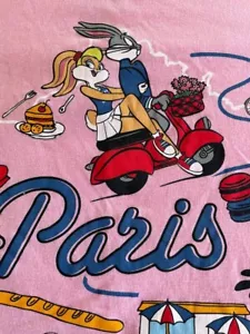 T-shirt grafica ROSA vintage Looney Tunes Bugs Tweety ciclomotore PARIS FRANCE TEAM USA - Foto 1 di 3