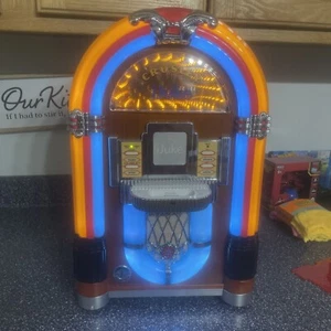 Crosley iJUKE i juke Jukebox Apple iPod CR1701A con control remoto y cable de alimentación TAN BONITO - Imagen 1 de 8