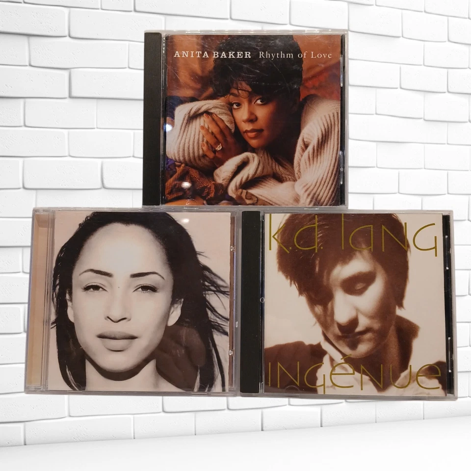 Trio of CD's: K.D. Lang (Ingenue), Sade (Best Of) & Anita Baker (Rhythm of Love) - Image 1 of 4
