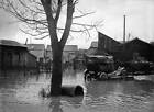 A flooded street in Viry-Chatillon, France on November 24, 1930 Old Photo