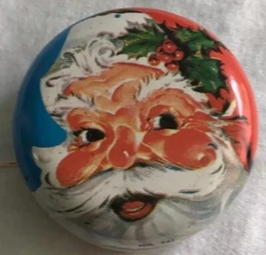 YoYo giocattolo vintage in metallo con faccia di Babbo Natale. Oggetto natalizio da collezione. - Foto 1 di 3
