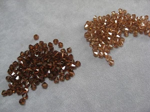 6 mm Bicone Swarovski Crystals Variations:  Lt. Smoky Topaz, Smoky Topaz - Picture 1 of 9
