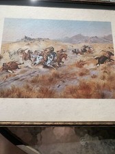 Framed C.M. Russell Stagecoach and Indians print. Signed